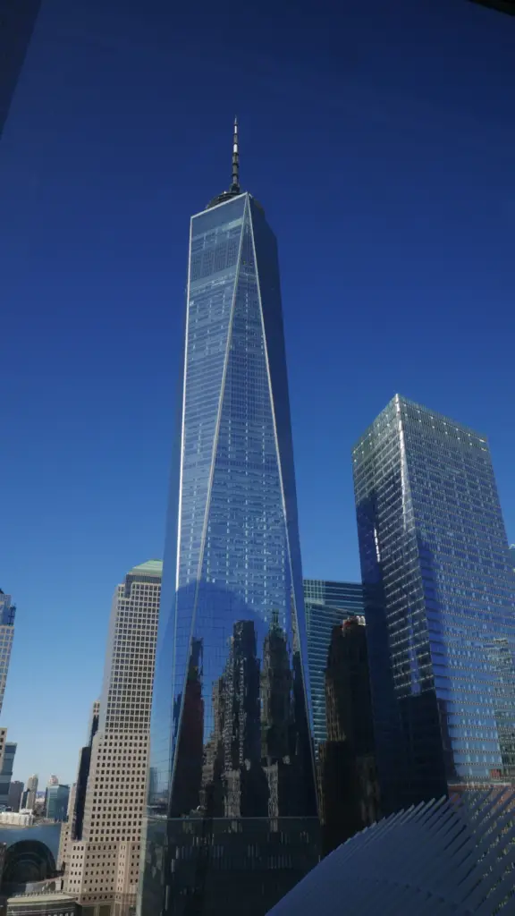 Modern high-rise office skyscraper against a clear blue sky